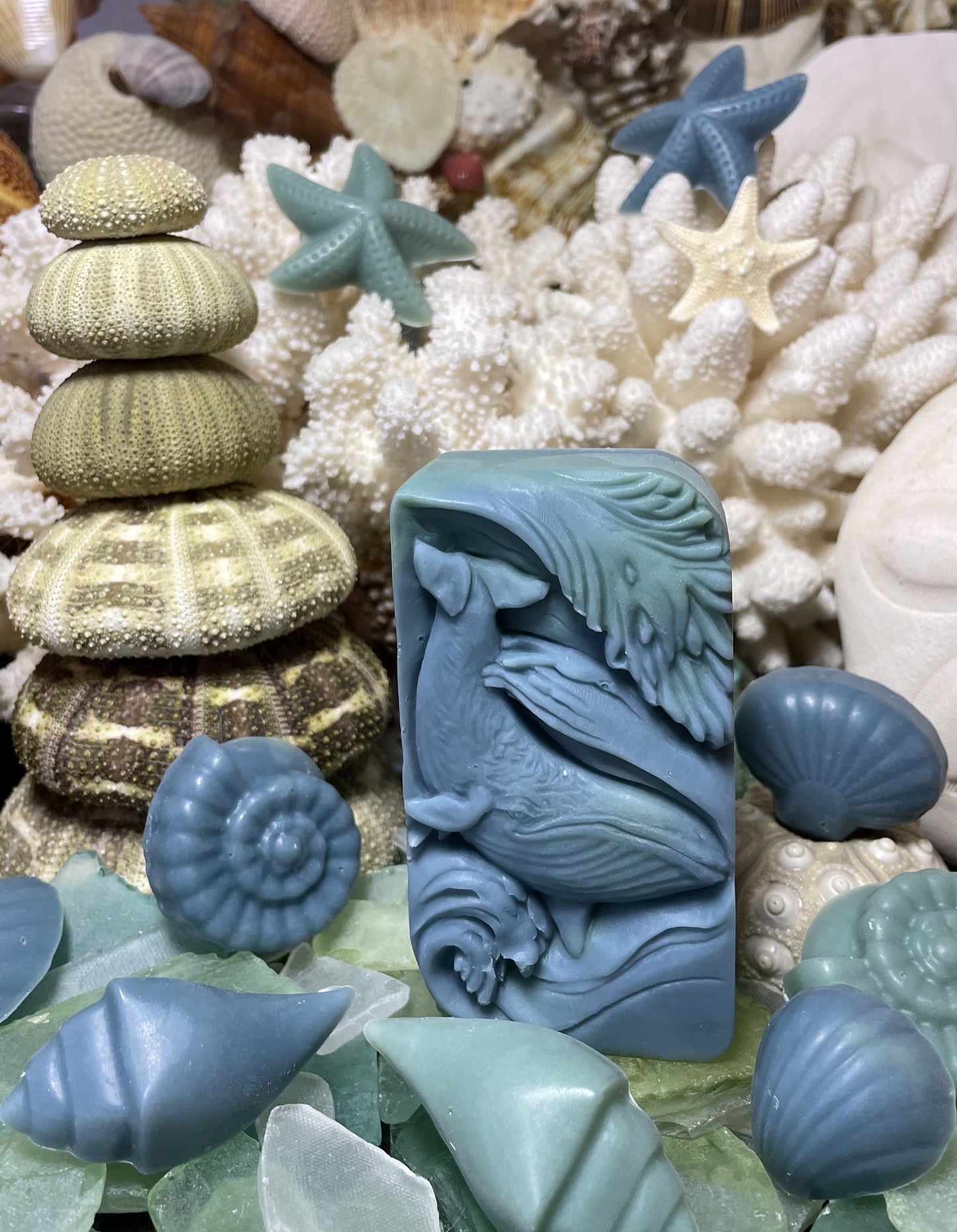 Whale Tale Signature Bar handcrafted soap in ocean blue, featuring an intricate whale design. Fragrance blend includes coconut water, key lime, pink Himalayan salt, and lotus with floral and citrus notes.