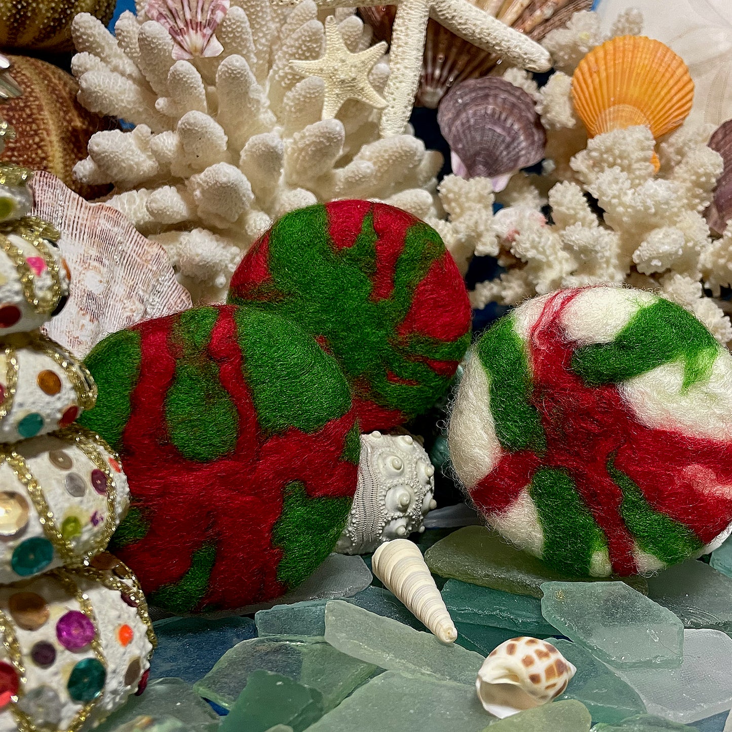 Festive red, green, and white hand-felted Merino wool Christmas soap bars from Whale Tale Soapworks, evoking cheerful coastal holiday vibes.