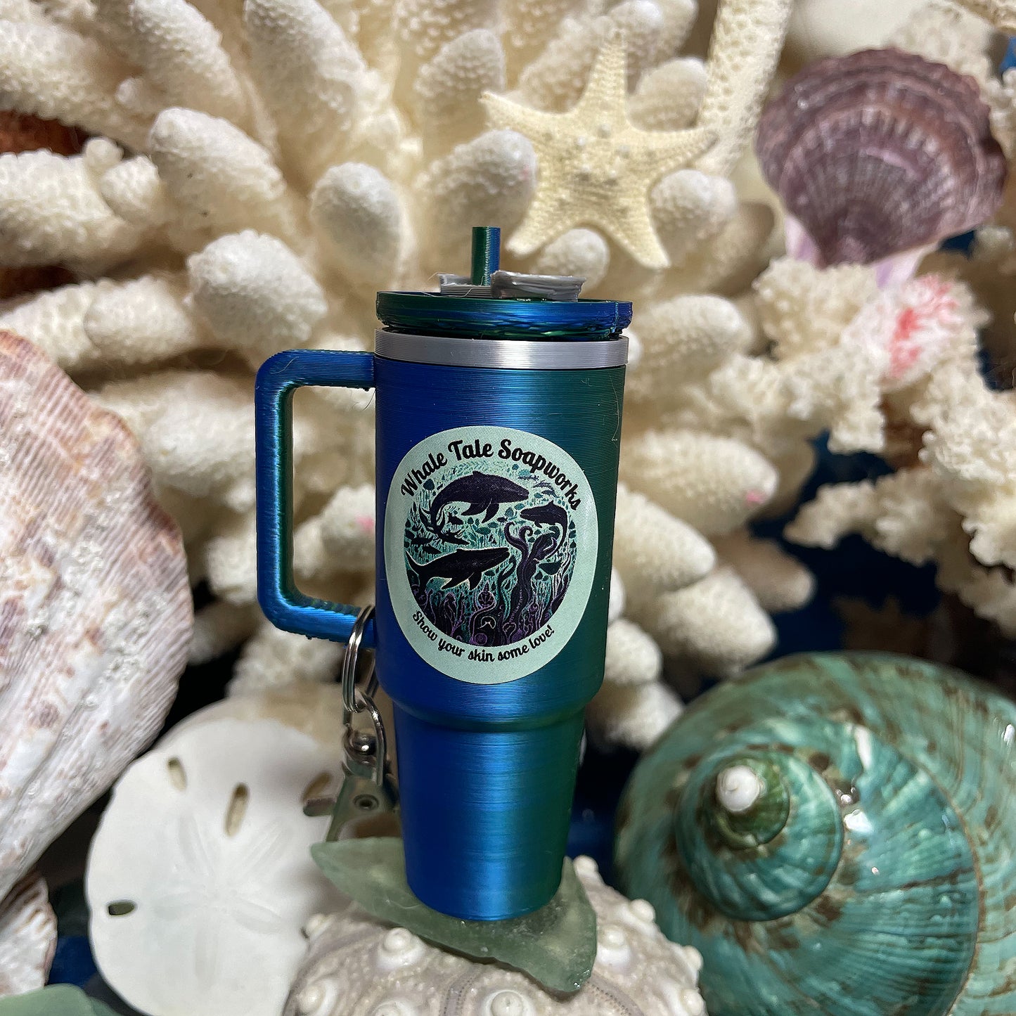 Mini Tumbler Lip Balm Keychain in color-changing blue and green with Whale Tale Soapworks logo.
