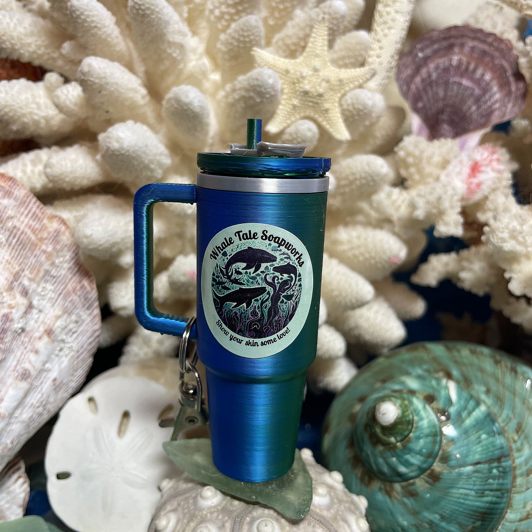 Mini Tumbler Lip Balm Keychain in color-changing blue and green with Whale Tale Soapworks logo.